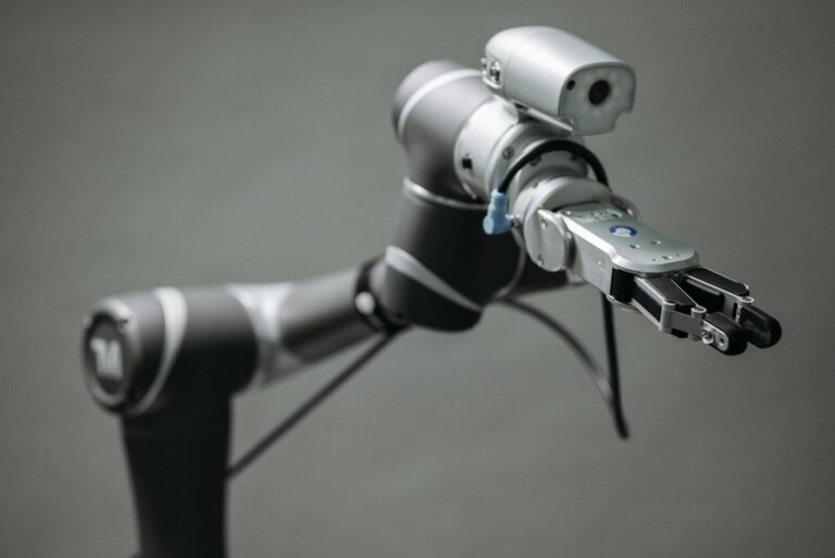 Close-up view of a robotic arm equipped with a video camera, showcasing modern technology.